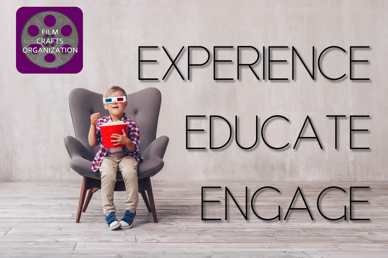 Boy Sitting on a chair eating popcorn with the Film Crafts Organization Slogan overlaid: Experience - Educate - Engage